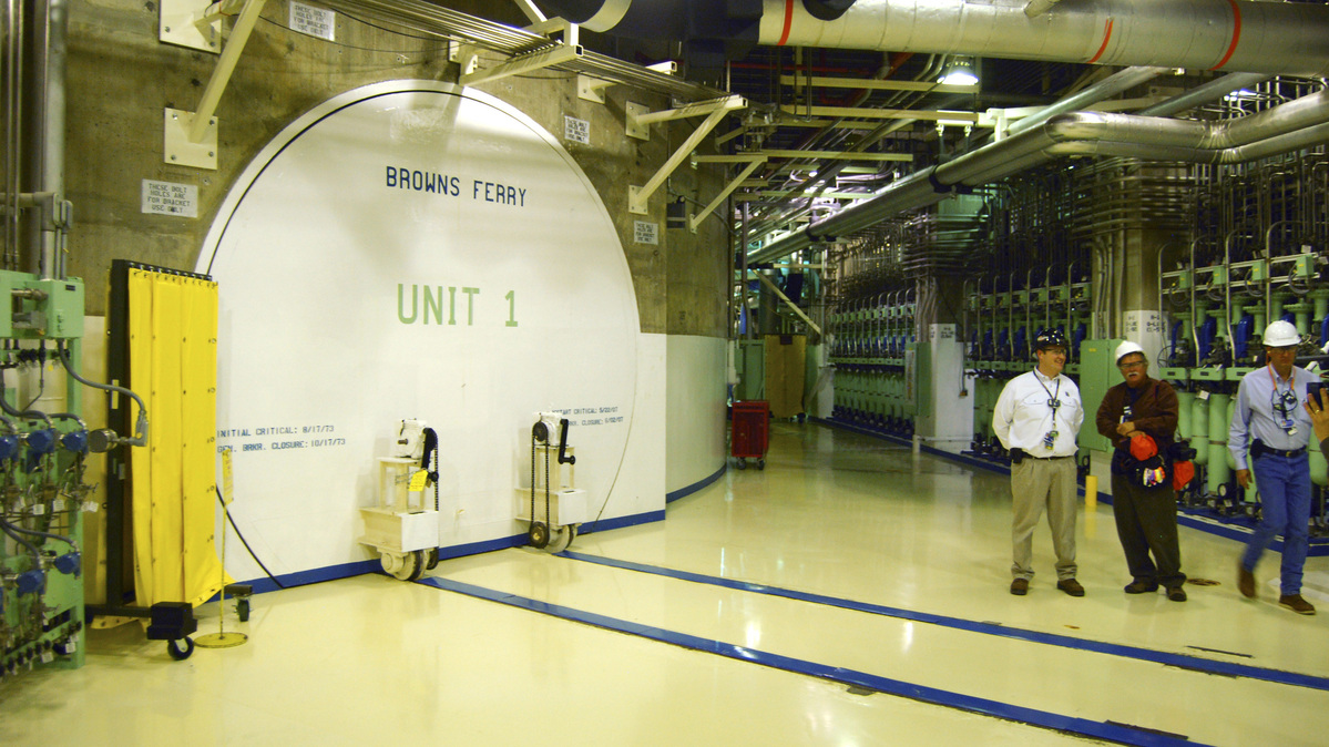 Nuclear officials stand near the entrance to a reactor at the Browns Ferry nuclear facility in Alabama, in this photo taken March 25, 2011. REUTERS/Matthew Bigg