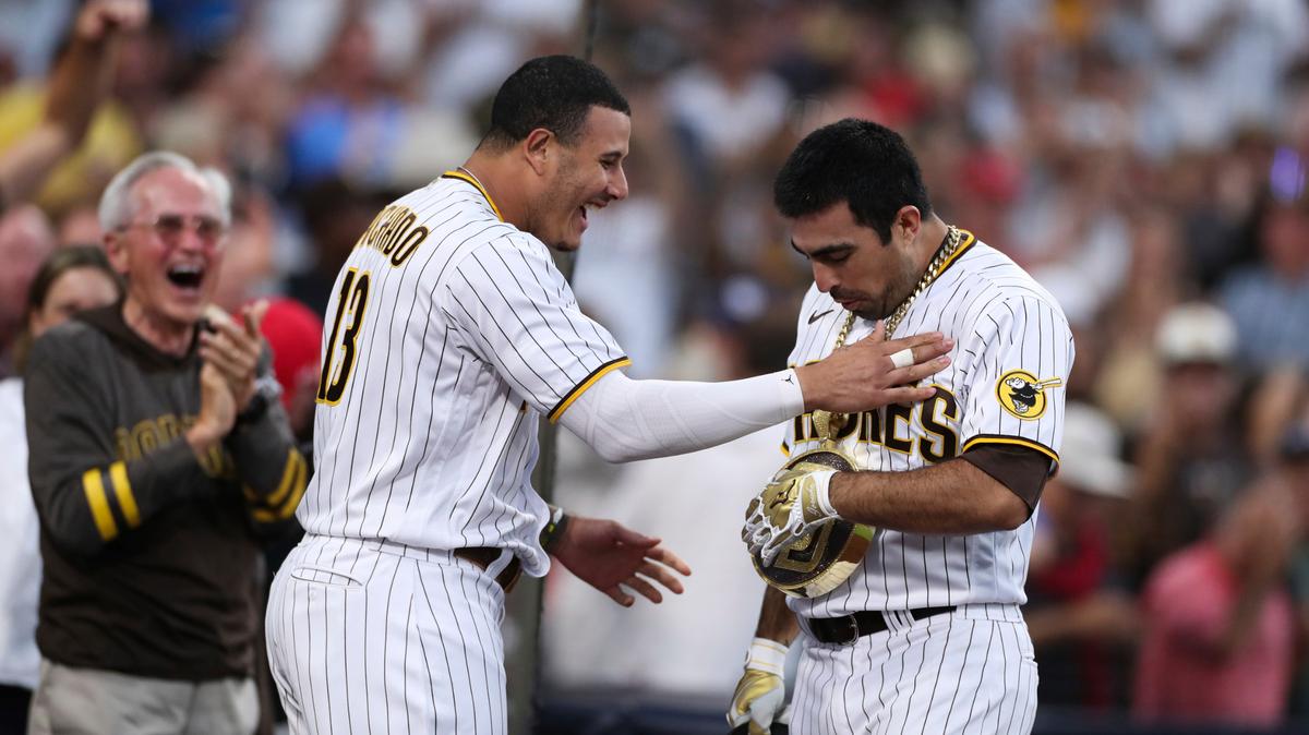 San Diego Padres’ Daniel Camarena, right, is congratulated by Manny Machado after hitting a grand slam off Washington Nationals starting pitcher Max Scherzer during the fourth inning of a baseball game Thursday, July 8, 2021, in San Diego. (AP Photo/Derrick Tuskan)