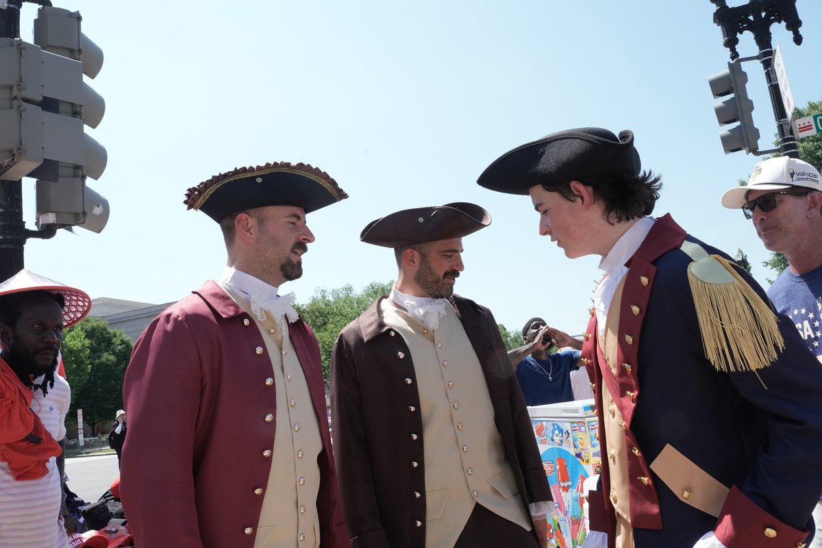People in colonial-era garb amid celebrations of the 250th anniversary of the United States in Washington, July 4, 2026. America celebrates the 250th anniversary of its independence today, with people from one end of the country to the other marking the milestone with fireworks, parades and concerts. (Alex Kent/The New York Times)