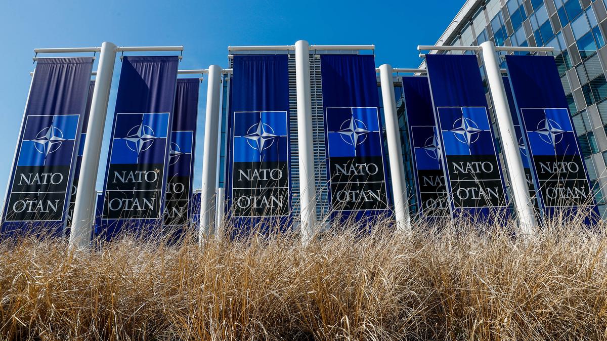 Banners displaying the NATO logo are placed at the entrance of new NATO headquarters during the move to the new building, in Brussels, Belgium April 19, 2018.  REUTERS/Yves Herman