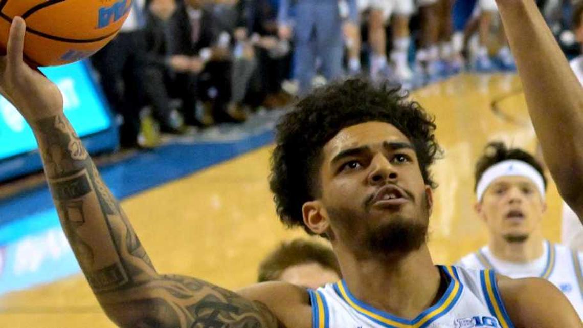  Feb 3, 2026; Los Angeles, California, USA; UCLA Bruins guard Eric Freeny (8) is defended by Rutgers Scarlet Knights guard Tariq Francis (0) in the first half at Pauley Pavilion presented by Wescom Financial. Mandatory Credit: Jayne Kamin-Oncea-Imagn Images | Jayne Kamin-Oncea-Imagn Images 