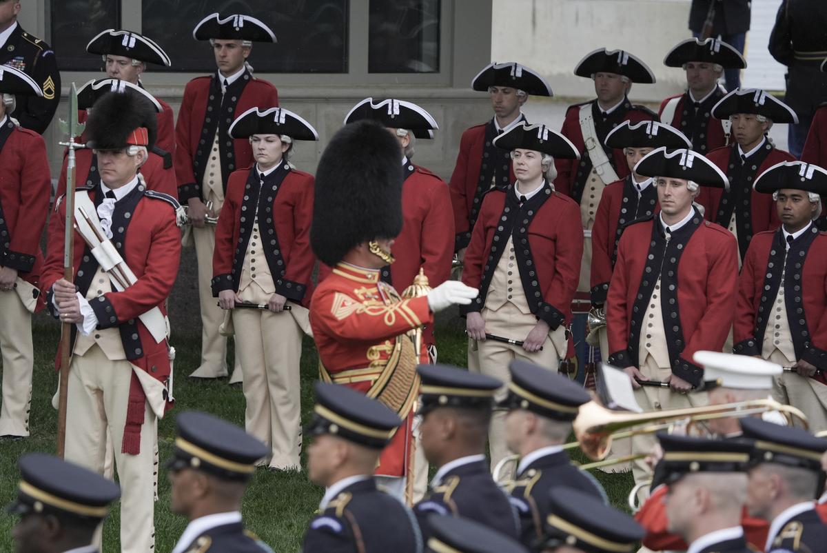 Members of the U.S. Army Old Guard Fife and Drum Corps at an arrival ceremony for King Charles III and Queen Camilla on the South Lawn of the White House in Washington, on Tuesday, April 28, 2026. (Salwan Georges/The New York Times)