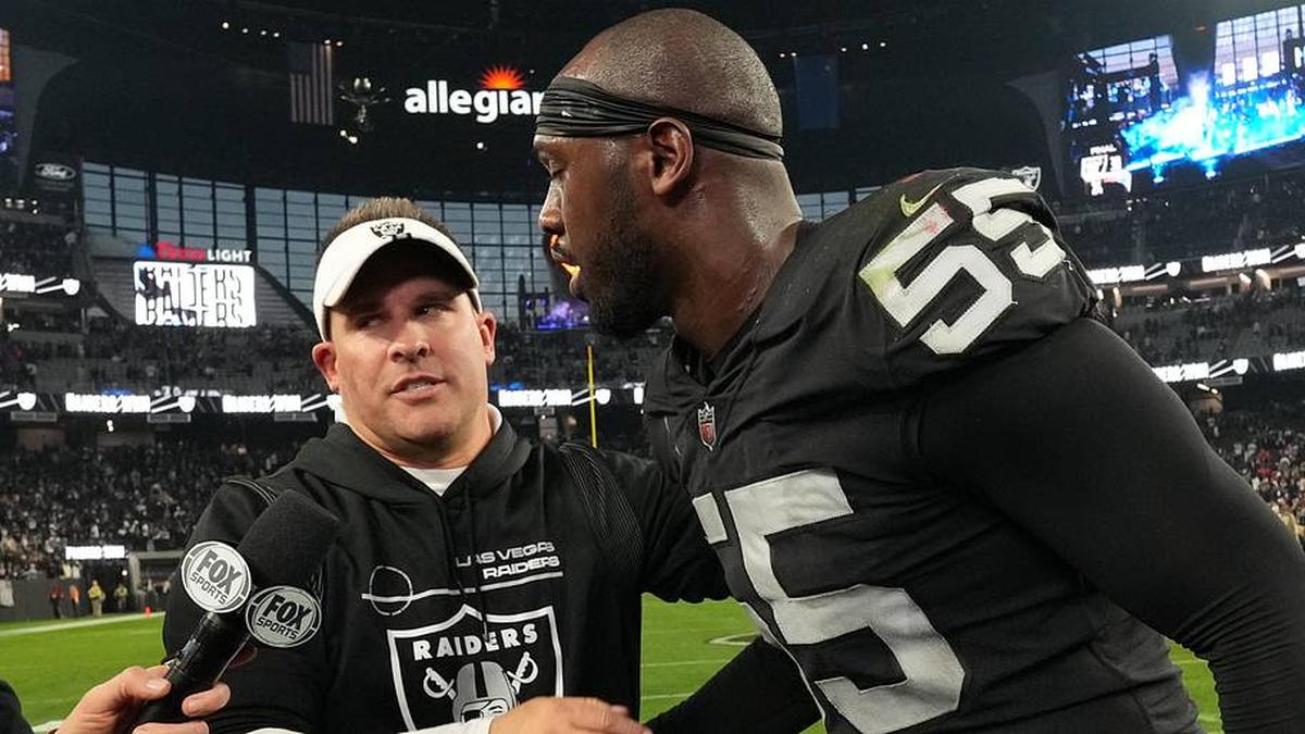  Dec 18, 2022; Paradise, Nevada, USA; Las Vegas Raiders coach Josh McDaniels (left) and defensive end Chandler Jones (55) embrace at the end of the game against the New England Patriots at Allegiant Stadium. The Raiders defeated the Patriots 30-24. Mandatory Credit: Kirby Lee-Imagn Images | Kirby Lee-Imagn Images 
