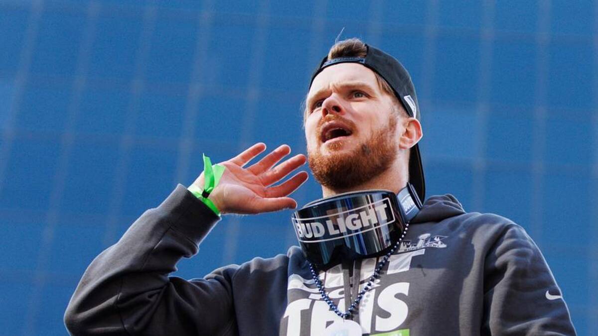  Feb 11, 2026; Seattle, WA, USA; Seattle Seahawks quarterback Sam Darnold (14) reacts during the Super Bowl LX parade. | Kevin Ng-Imagn Images 