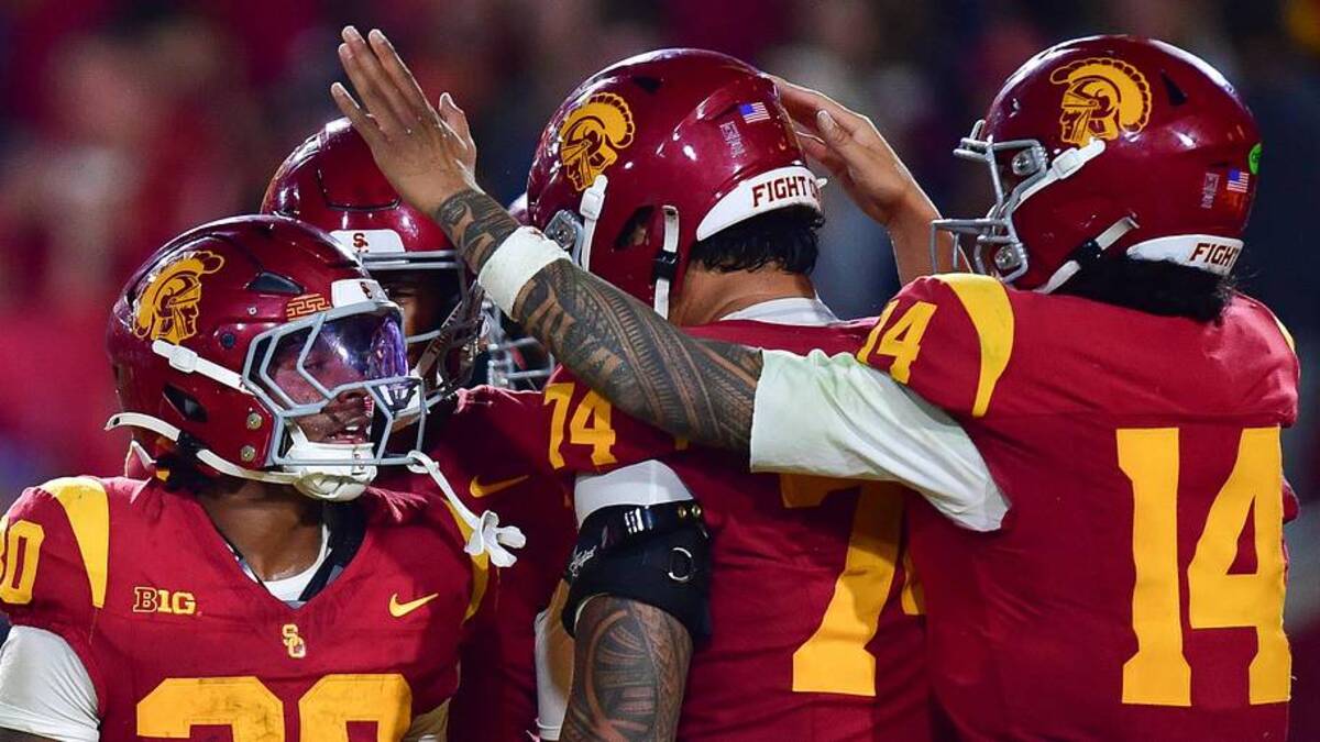  Nov 7, 2025; Los Angeles, California, USA; Southern California Trojans running back King Miller (30) celebrates his touchdown scored against the Northwestern Wildcats with offensive lineman Justin Tauanuu (74) and quarterback Jayden Maiava (14) during the first half at the Los Angeles Memorial Coliseum. Mandatory Credit: Gary A. Vasquez-Imagn Images | Gary A. Vasquez-Imagn Images 