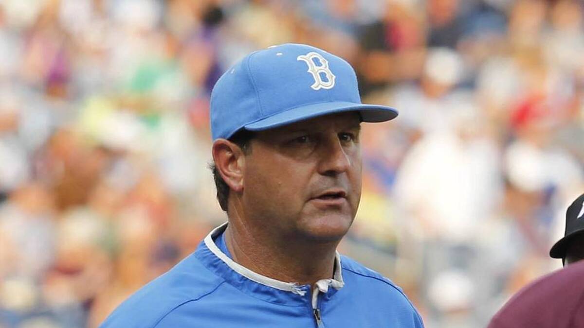  Jun 25, 2013; Omaha, NE, USA; UCLA Bruins head coach John Savage (22) talks to Mississippi State Bulldogs assistant coach Nick Mingione (27) before game 2 of the College World Series finals at TD Ameritrade Park. Mandatory Credit: Bruce Thorson-Imagn Images | Bruce Thorson-Imagn Images 