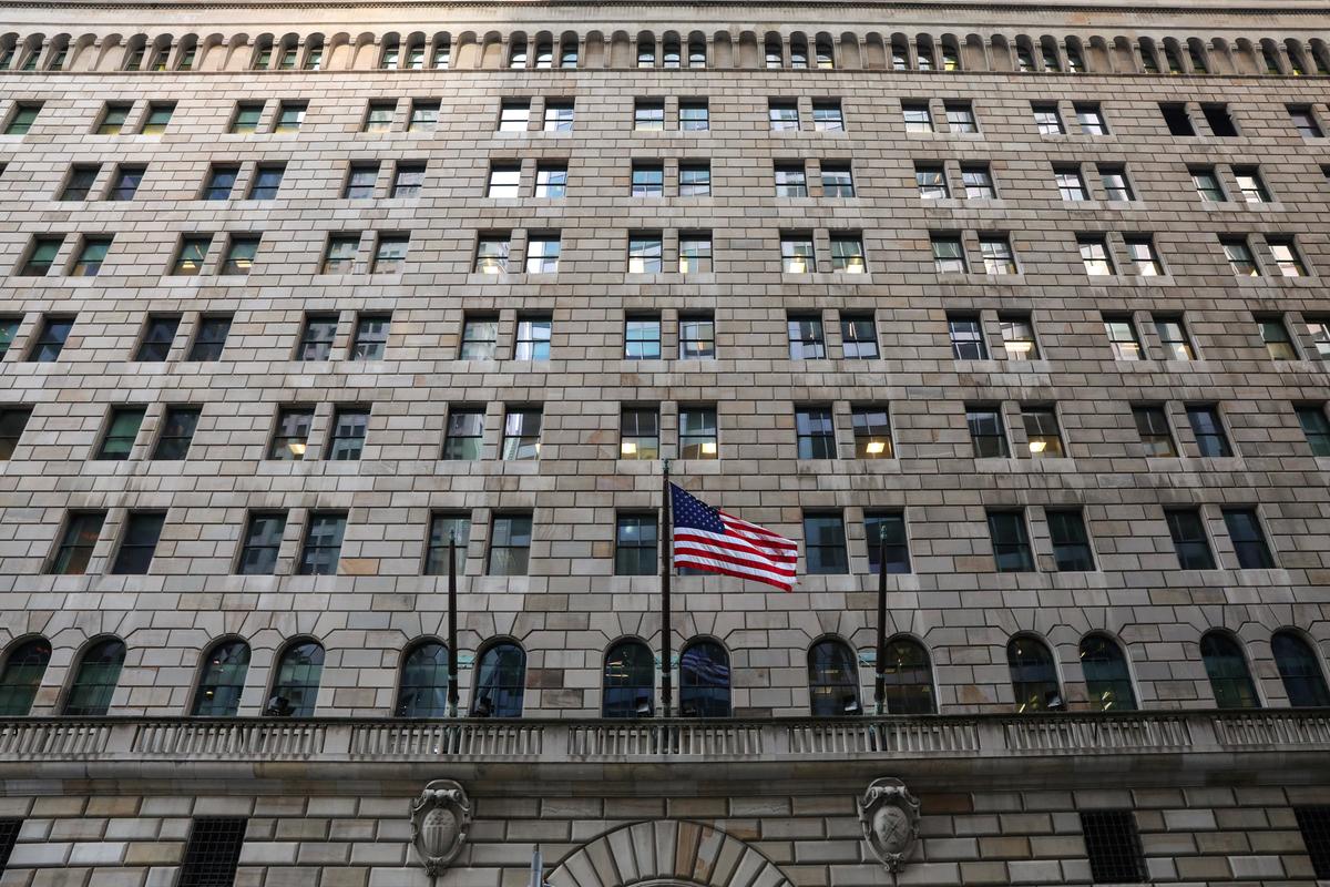 The U.S. flag flies on the Federal Reserve Bank of New York in the financial district in New York City, U.S., March 4, 2019. REUTERS/Brendan McDermid