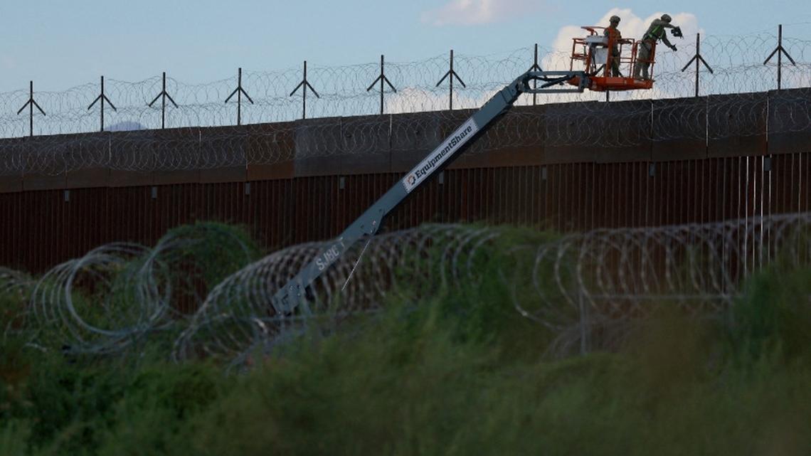 US judge blocks key parts of Texas migrant arrest law 
