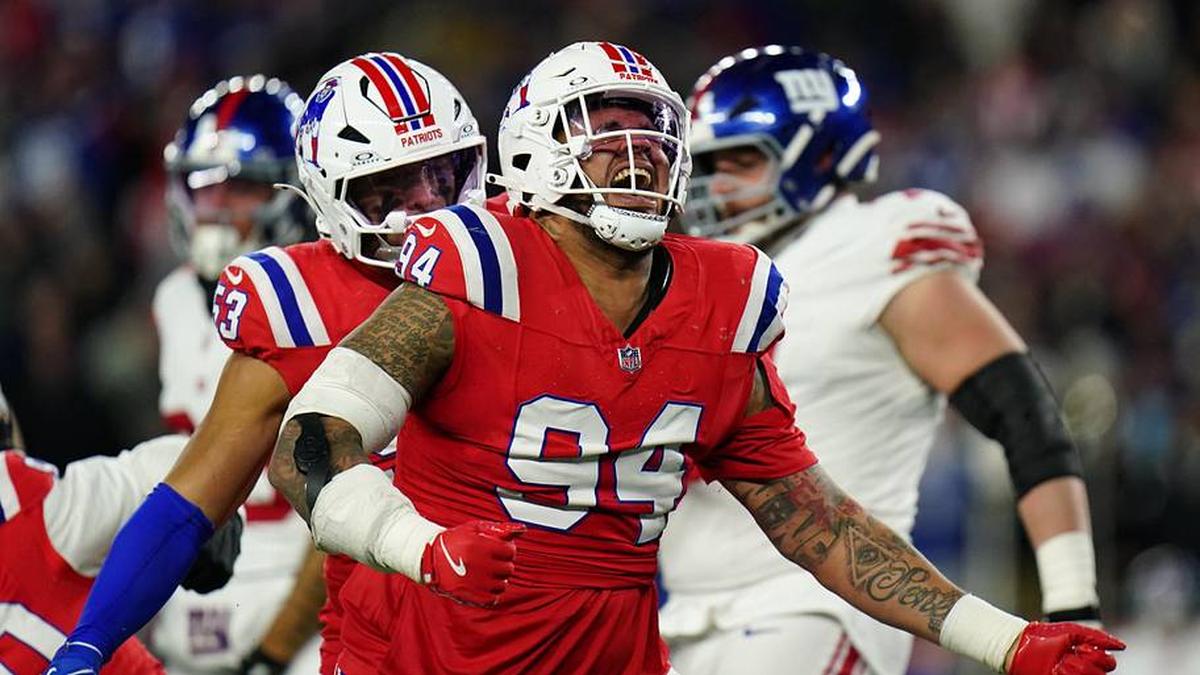  Dec 1, 2025; Foxborough, Massachusetts, USA; New England Patriots defensive tackle Cory Durden (94) celebrates after a play during the fourth quarter against the New York Giants at Gillette Stadium. Mandatory Credit: David Butler II-Imagn Images | David Butler II-Imagn Images 