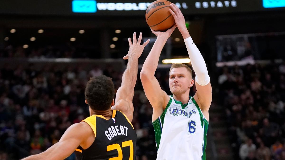 Dallas Mavericks center Kristaps Porzingis shoots over Utah Jazz center Rudy Gobert during their game Dec. 25 in Salt Lake City. The Mavericks traded Porzingis to the Washington Wizards on Thursday.