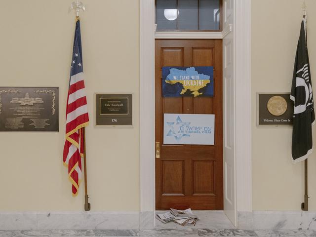 Newspapers in front of former Rep. Eric Swalwell's office at the Canon House Office Building in Washington, on Tuesday, April 14, 2026. Aides to Govs. Greg Abbott of Texas and Gavin Newsom of California are weighing whether to call quick elections to replace Tony Gonzales and Swalwell, respectively, House members accused of sexual misconduct. (Caroline Gutman/The New York Times)