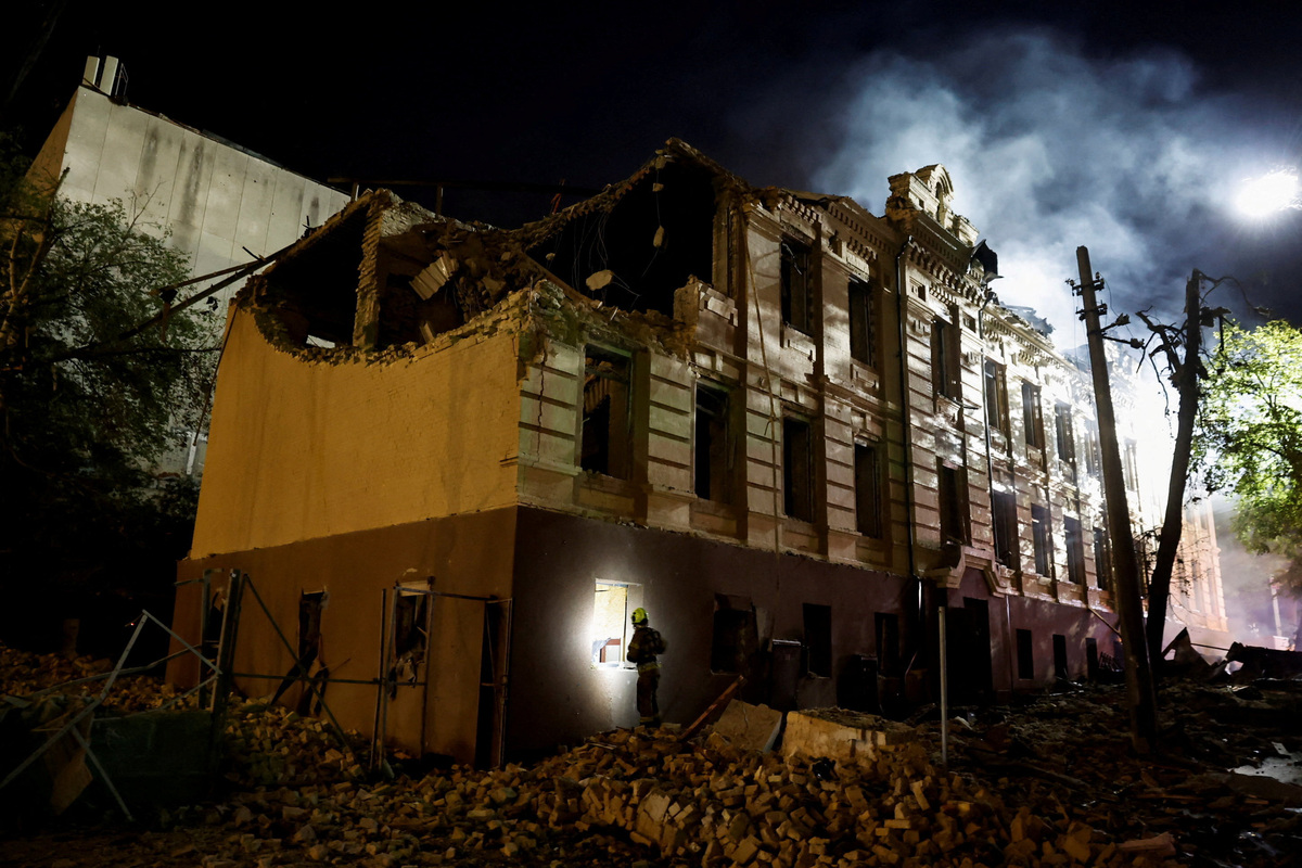 A firefighter works at a site of a building damaged during Russian missile strikes, amid Russia’s attack on Ukraine, in Kyiv, Ukraine July 19, 2026. REUTERS/Thomas Peter