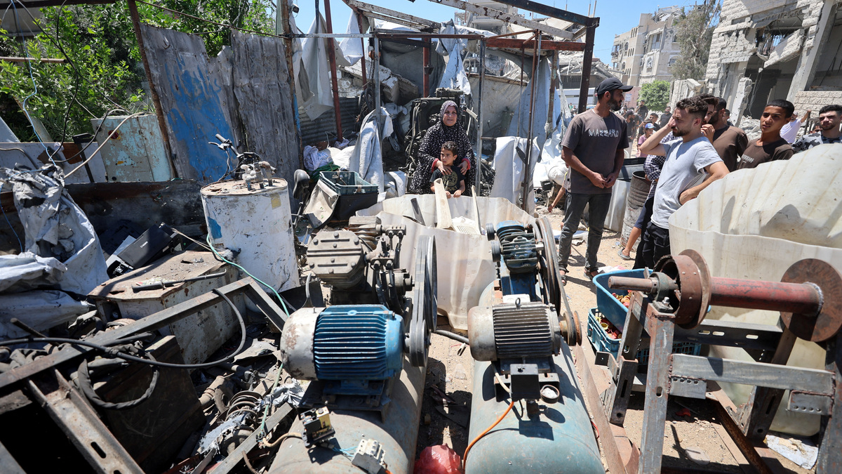 Palestinians inspect the site of an Israeli strike on a metal foundry in Gaza City, July 12, 2026. REUTERS/Dawoud Abu Alkas