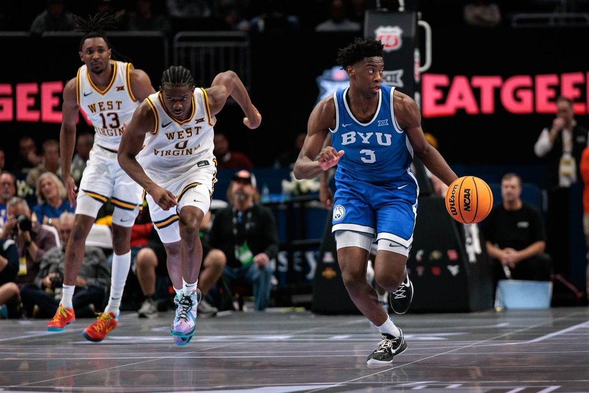  BYU Cougars forward AJ Dybantsa (3) brings the ball up court ahead of West Virginia Mountaineers forward Brenen Lorient (0) during the second half at T-Mobile Center. 