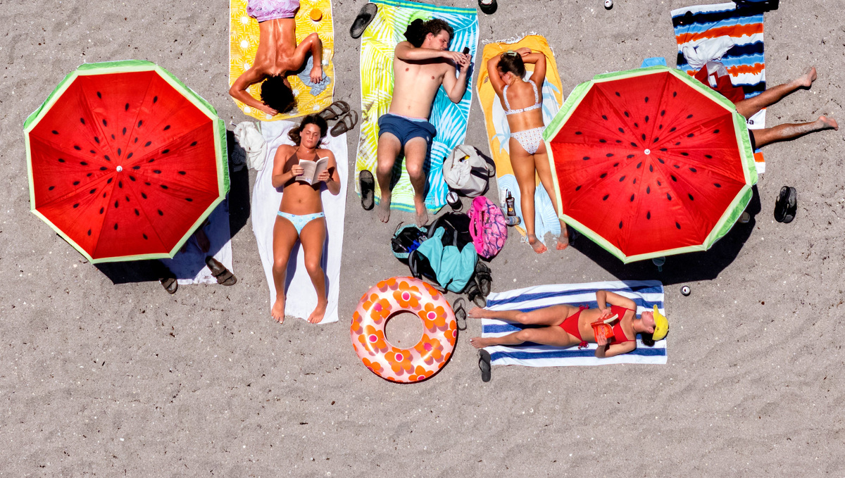 Beachgoers soak up the sun as they enjoy the Memorial Day holiday on May 25, 2026, in Juno Beach, Florida.