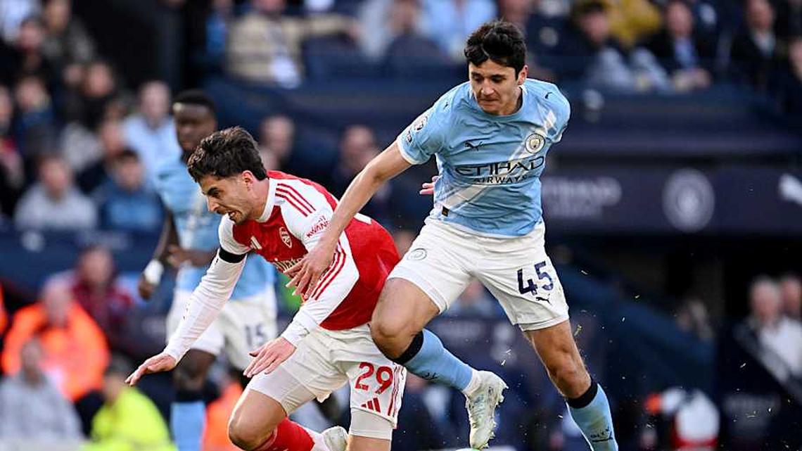  Kai Havertz (left) went to ground after a strong challenge from Abdukodir Khusanov. | Stuart MacFarlane/Arsenal FC/Getty Images 