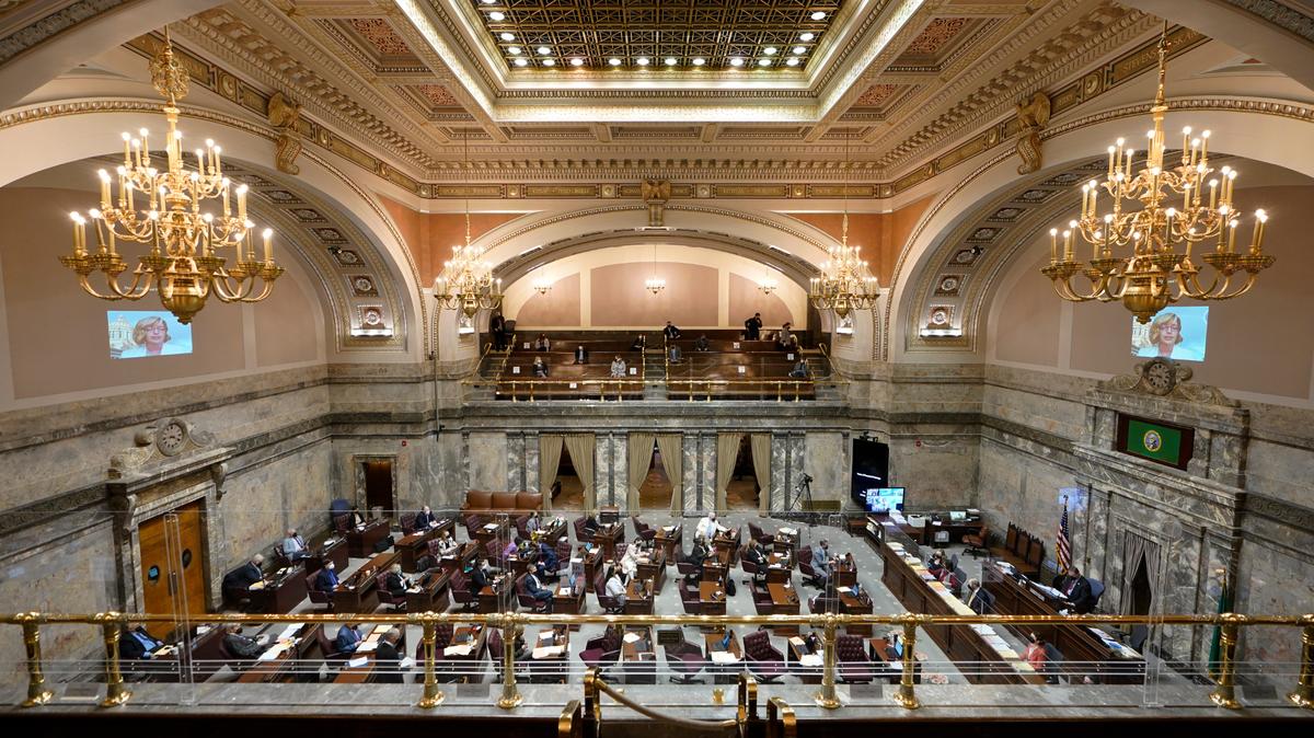 Lawmakers meet on the Senate floor in March 2022 at the Capitol in Olympia, Wash.