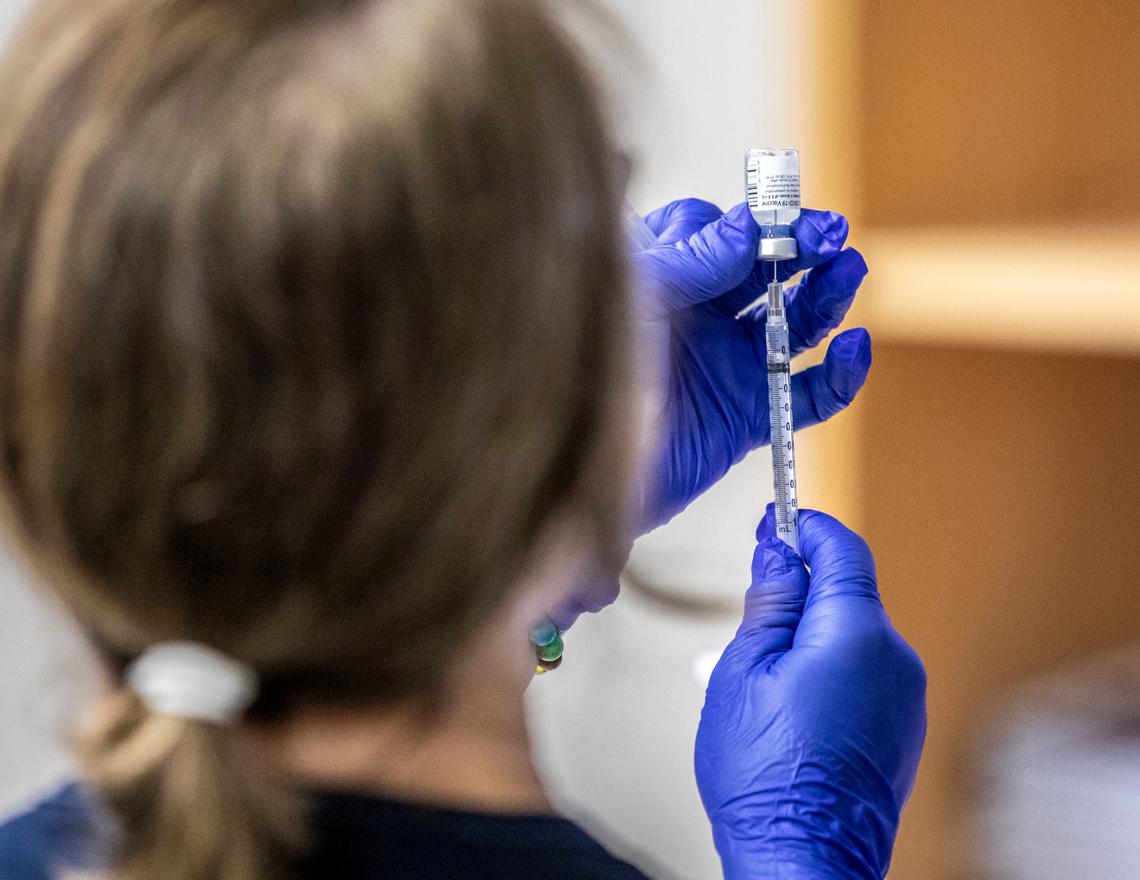 Jennifer Van Aernem, Director of Education at the Conway Medical Center (CMC) prepares to administer the Pfizer-issued coronavirus vaccine. The CMC took delivery of 975 doses of the Pfizer issued COVID-19 vaccination on Monday and immediately began vaccinating hospital staff. By Monday, Dec. 14, 2020, 105 workers had registered to get the two-part vaccination. (Jason Lee/The Sun News via AP)