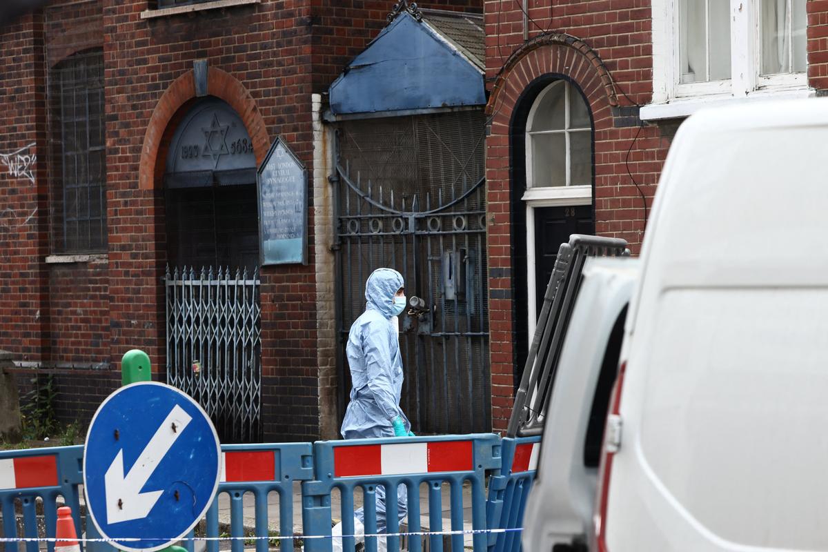 A forensics officer works at the scene of a suspected arson attack on a former synagogue in London, Britain May 5, 2026. REUTERS/Jack Taylor