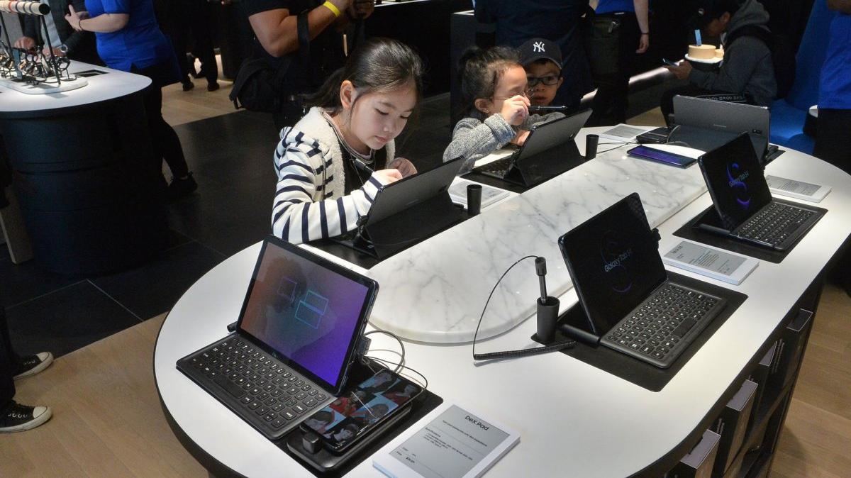 Children play with computers on display at the Glendale Galleria in Glendale, Calif., on February 20, 2019. On Wednesday, the Trump administration issued a surgeon general's warning about too much screen time for young people. File Photo by Jim Ruymen/UPI