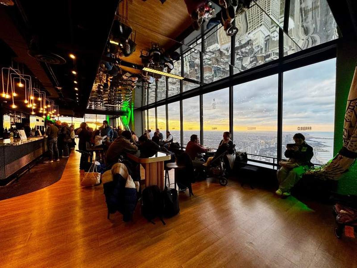  CloudBar at the 360 CHICAGO Observation Deck on the 94th floor offers panoramic views of the Chicago skyline and Lake Michigan, a perfect stop included with CityPASS for unforgettable city views from above. Photo credit: Emily Molina 