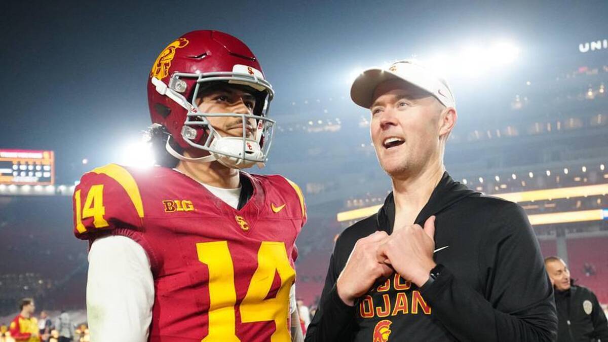  Nov 29, 2025; Los Angeles, California, USA; Southern California Trojans quarterback Jayden Maiava (14) and head coach Lincoln Riley react after the game against the UCLA Bruins at United Airlines Field at Los Angeles Memorial Coliseum. Mandatory Credit: Kirby Lee-Imagn Images | Kirby Lee-Imagn Images 