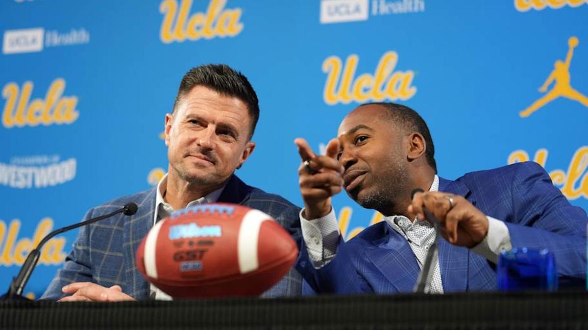  Dec 9, 2025; Los Angeles, CA, USA; UCLA Bruins football coach Bob Chesney (left) and athletic director Martin Jarmond at introductory press conference at Renee Luskin Conference Center Centennial Ballroom. Mandatory Credit: Kirby Lee-Imagn Images | Kirby Lee-Imagn Images 