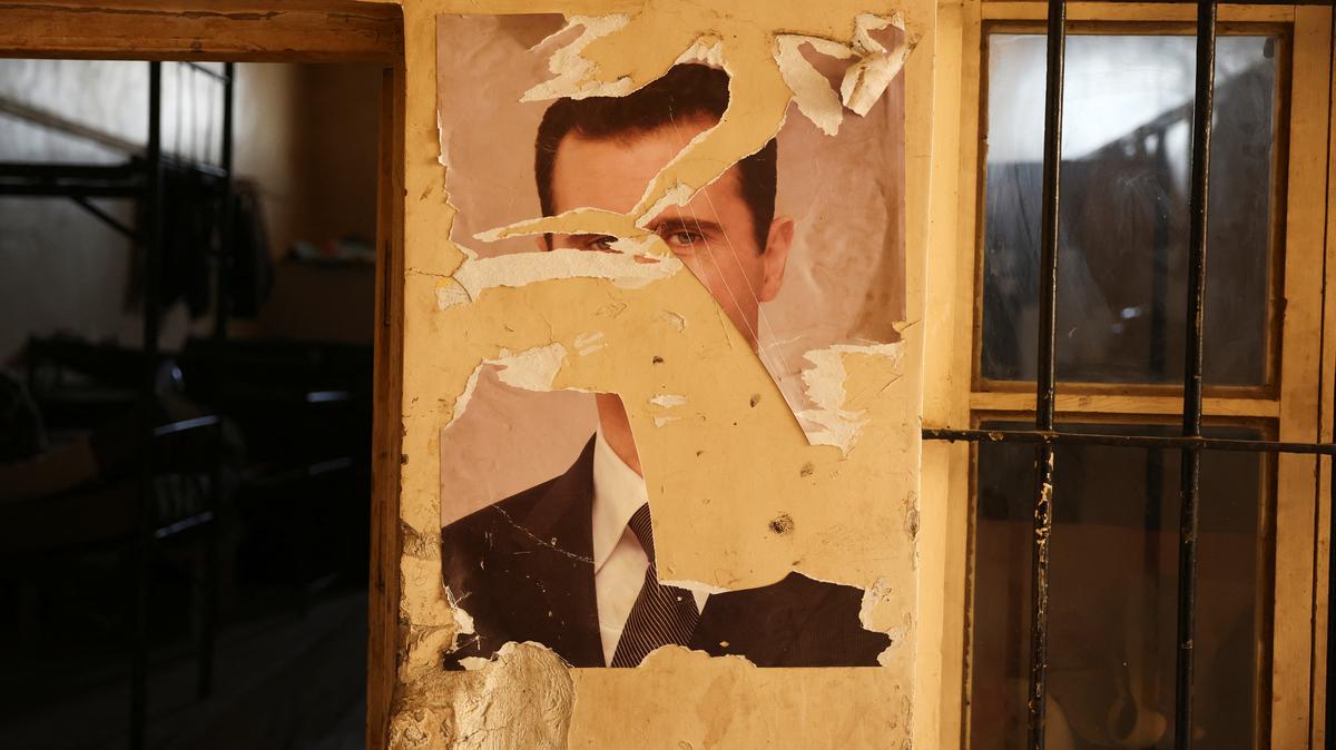 A damaged portrait of former Syrian President Bashar al-Assad at a military base in Damascus, Syria, December 15, 2024. REUTERS/Amr Alfiky