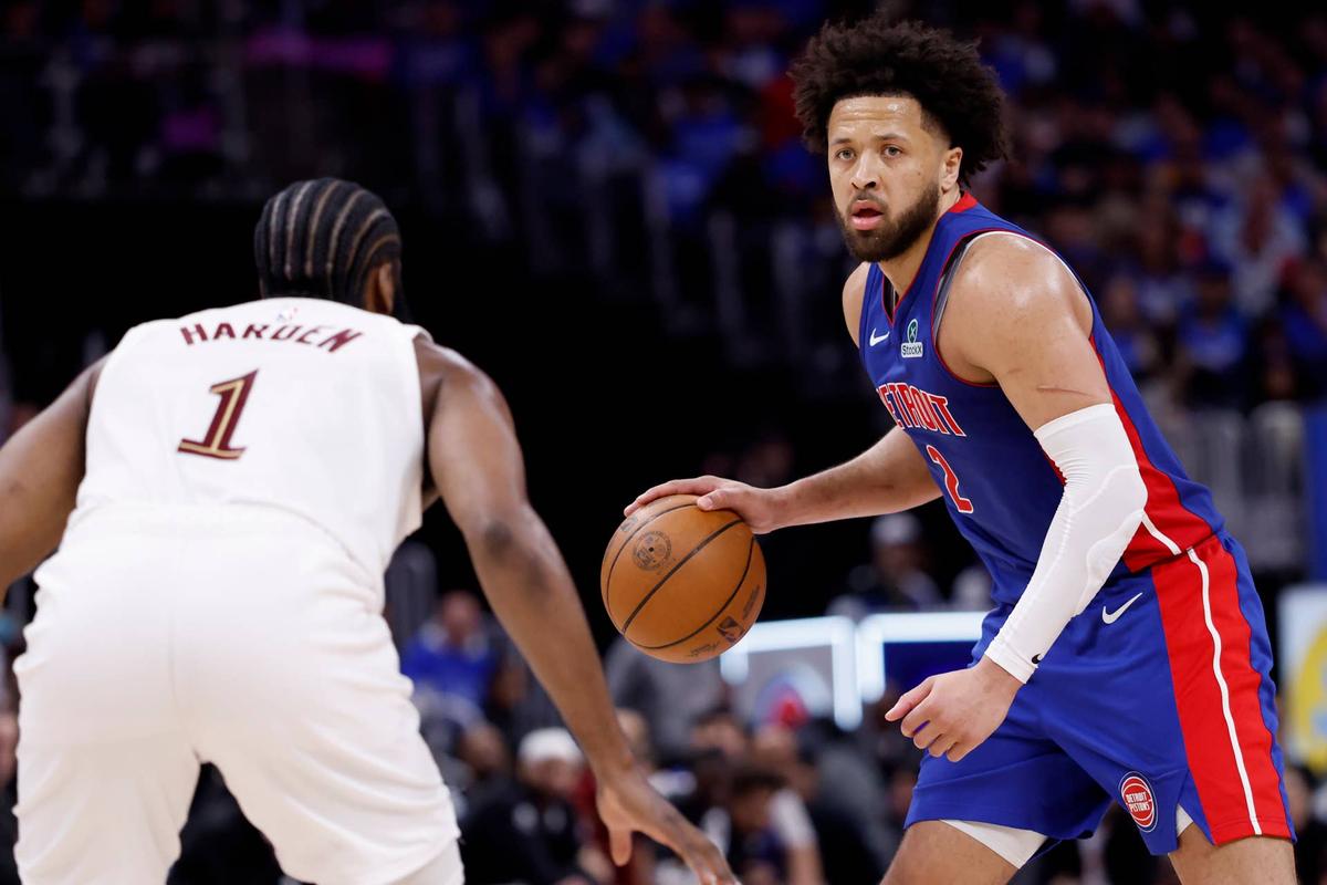  Detroit Pistons guard Cade Cunningham (2) dribbles defended by Cleveland Cavaliers guard James Harden (1). 