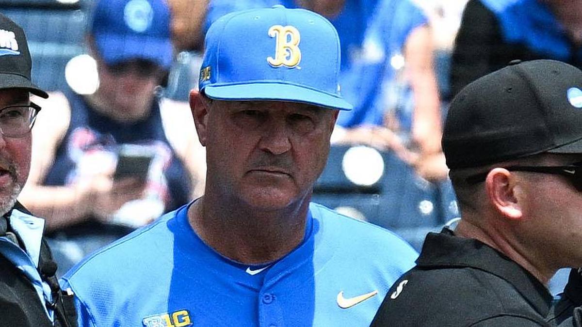  Jun 14, 2025; Omaha, Neb, USA; Murray State Racers head coach Dan Skirka and UCLA Bruins head coach John Savage meet with umpires before the game at Charles Schwab Field. Mandatory Credit: Steven Branscombe-Imagn Images | Steven Branscombe-Imagn Images 