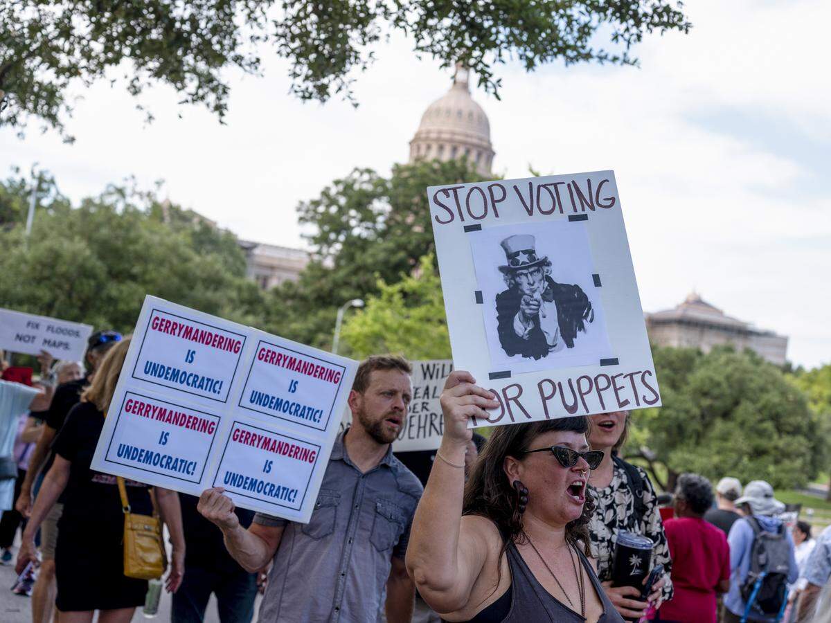 People protest the Republican-led redistricting and support Democratic members of the Texas House outside the Governor’s Mansion in Austin, Texas, on Monday.