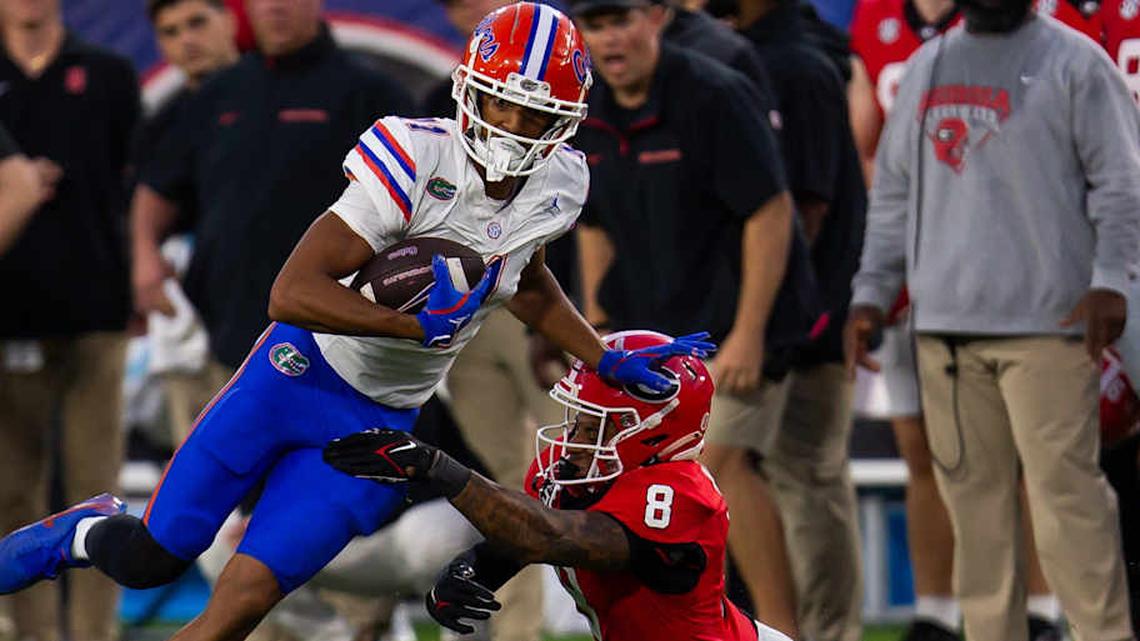  Florida Gators wide receiver Aidan Mizell (11) eludes Georgia Bulldogs defensive back Joenel Aguero (8) during the second half at EverBank Stadium in Jacksonville, FL on Saturday, November 2, 2024. The Bulldogs defeated the Gators 34-20. [Doug Engle/Gainesville Sun] | Doug Engle/Gainesville Sun / USA TODAY NETWORK via Imagn Images 
