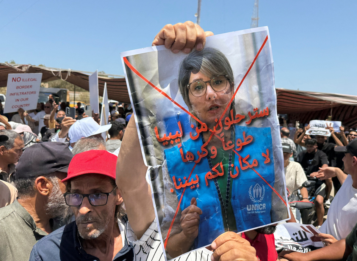 Protesters gather outside the headquarters of the United Nations High Commissioner for Refugees (UNHCR), demanding the organisation leave the country and calling for an end to migrant settlement and the deportation of migrants and refugees, in Tripoli, Libya, June 4, 2026. Picture taken with a mobile phone. REUTERS/Ayman al-Sahili