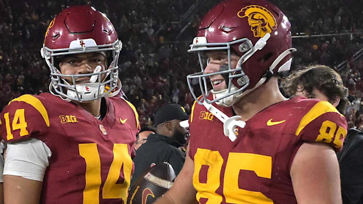  Oct 11, 2025; Los Angeles, California, USA; USC Trojans offensive lineman Micah Banuelos (59), quarterback Jayden Maiava (14) and USC Trojans defensive end Jadyn Ramos (95) celebrate after defeating the Michigan Wolverines at United Airlines Field at the Los Angeles Memorial Coliseum. Mandatory Credit: Jayne Kamin-Oncea-Imagn Images | Jayne Kamin-Oncea-Imagn Images 