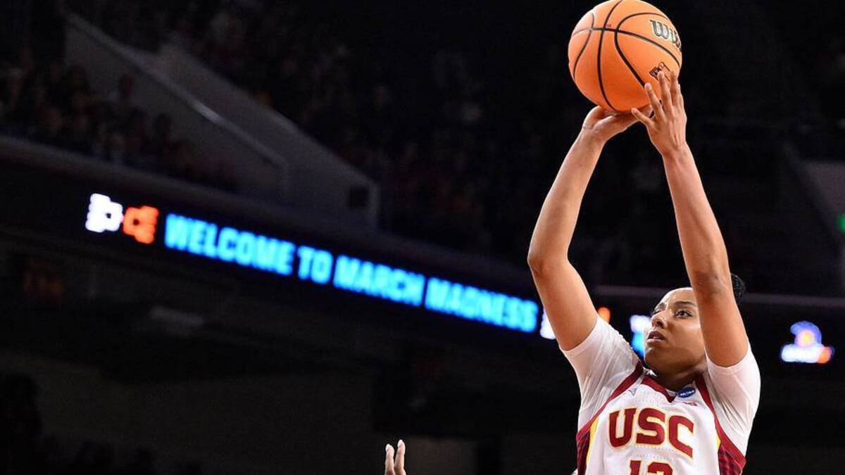  Mar 22, 2025; Los Angeles, California, USA; USC Trojans guard JuJu Watkins (12) shoots over UNC Greensboro Spartans guard Jaila Lee (4) during the second quarter of an NCAA Tournament game at Galen Center. Mandatory Credit: Robert Hanashiro-Imagn Images | Robert Hanashiro-Imagn Images 
