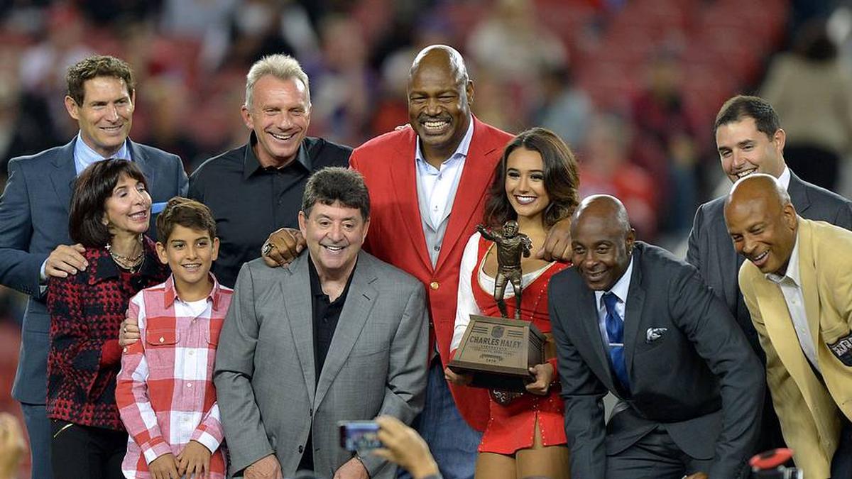 Sep 14, 2015; Santa Clara, CA, USA; San Francisco 49ers former defensive end Charles Haley (center) poses with Steve Young, Denise DeBartolo York, Eddie DeBartolo Jr., Joe Montana, Jerry Rice, Jed York and Ronnie Lott during halftime ceremony at Levi's Stadium. Mandatory Credit: Kirby Lee-Imagn Images | Kirby Lee-Imagn Images 