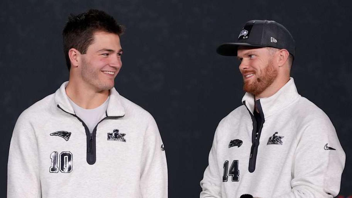  Feb 2, 2026; San Jose, CA, USA; Seattle Seahawks quarterback Sam Darnold (14) and New England Patriots quarterback Drake Maye (10) look on during Opening Night for Super Bowl LX at San Jose Convention Center. Mandatory Credit: Cary Edmondson-Imagn Images | Cary Edmondson-Imagn Images 