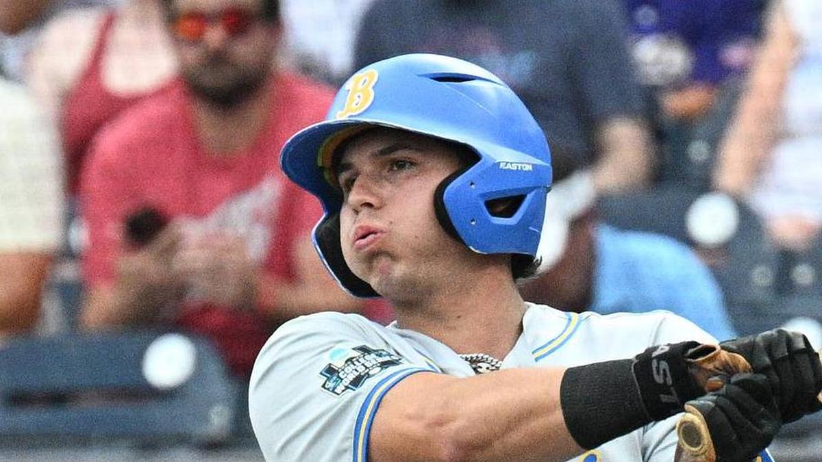  Jun 16, 2025; Omaha, Neb, USA; UCLA Bruins third baseman Roman Martin (7) doubles in a run against the LSU Tigers during the first inning at Charles Schwab Field. Mandatory Credit: Steven Branscombe-Imagn Images | Steven Branscombe-Imagn Images 