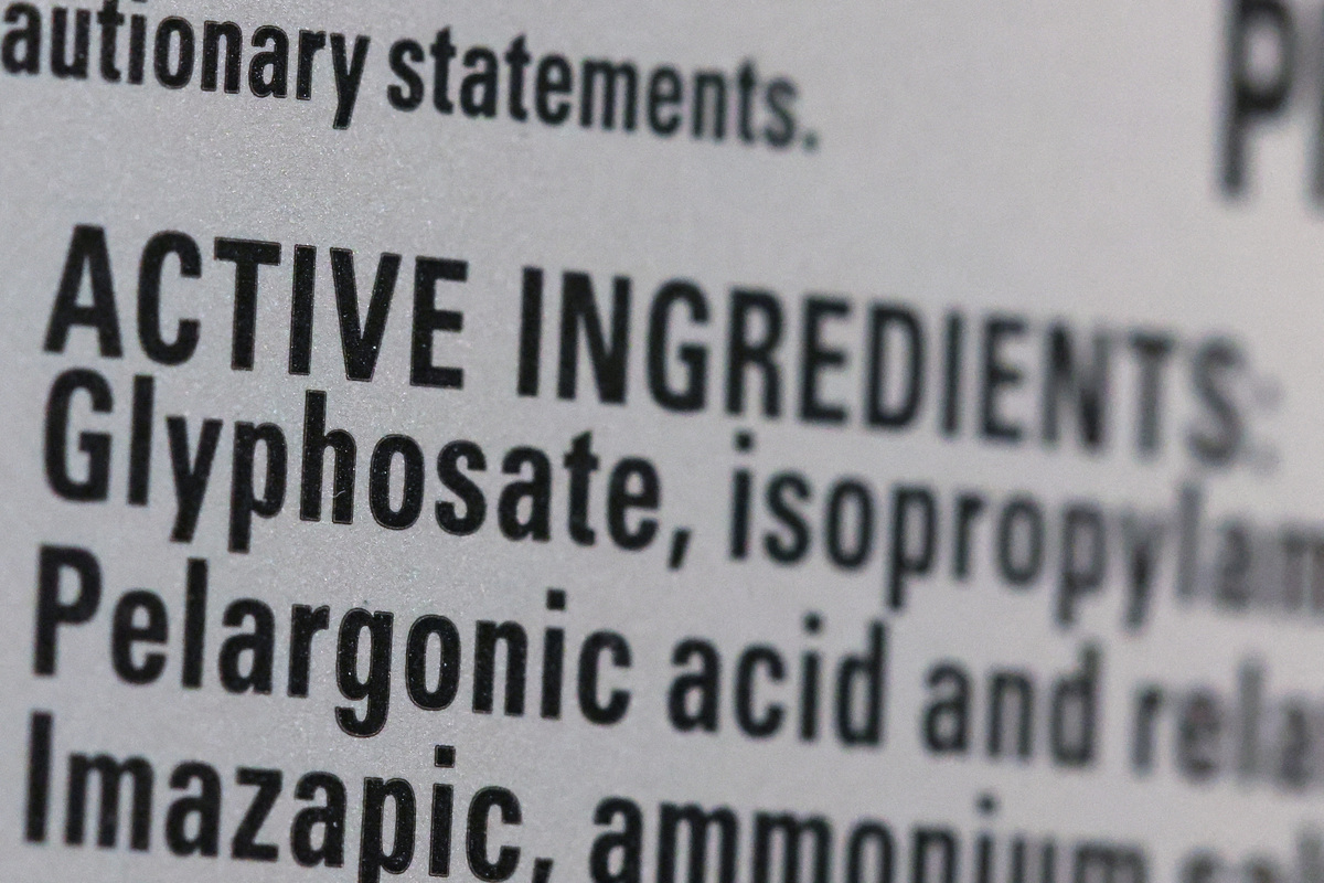 FILE PHOTO: Roundup's list of ingredients, including Glyphosate, is seen on a bottle set for sale in a store in Manhattan, New York City, U.S., June 30, 2022. REUTERS/Andrew Kelly/File Photo