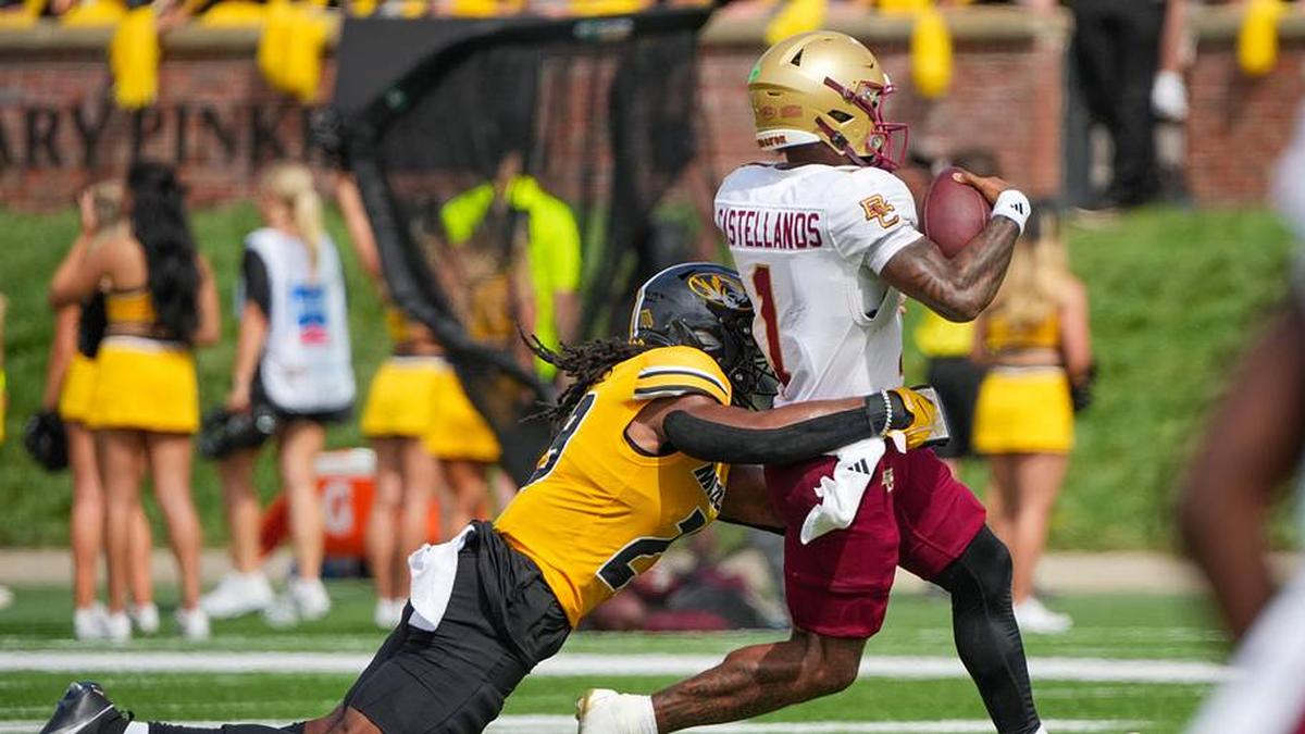  Sep 14, 2024; Columbia, Missouri, USA; Boston College Eagles quarterback Thomas Castellanos (1) runs the ball as Missouri Tigers linebacker Khalil Jacobs (29) makes the tackle during the second half at Faurot Field at Memorial Stadium. Mandatory Credit: Denny Medley-Imagn Images | Denny Medley-Imagn Images 