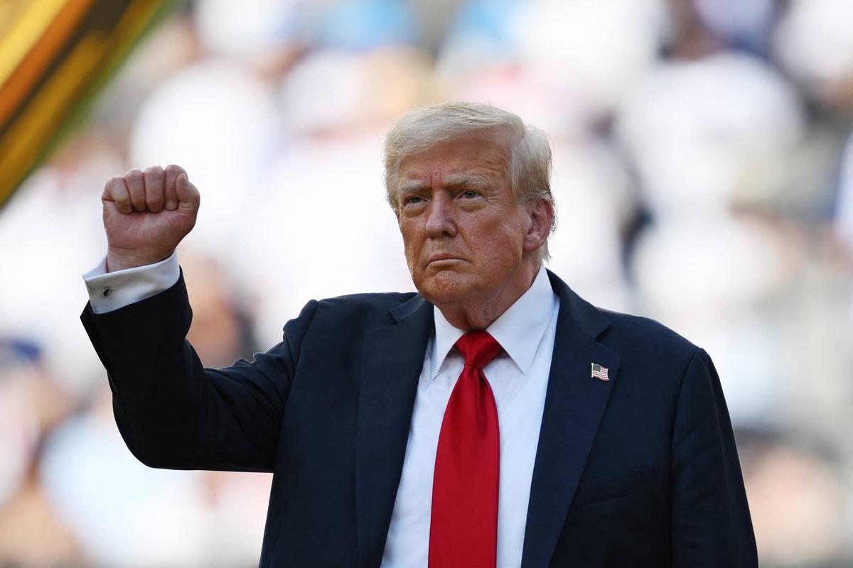  US President Donald Trump gestures during the award ceremony for the FIFA Club World Cup 2025 Champions, following the final football match between England's Chelsea and France's Paris Saint-Germain at the MetLife Stadium in East Rutherford, New Jersey on July 13, 2025. (Photo by ANGELA WEISS / AFP) (Photo by ANGELA WEISS/AFP via Getty Images) 