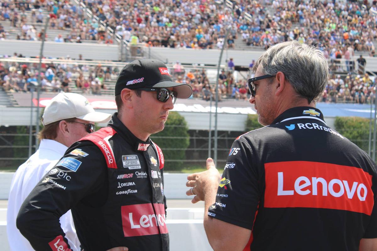  Driver Kyle Busch speaks with a crew member ahead of the NASCAR Cup Series race at Pocono Raceway on Sunday, July 23, 2023. 