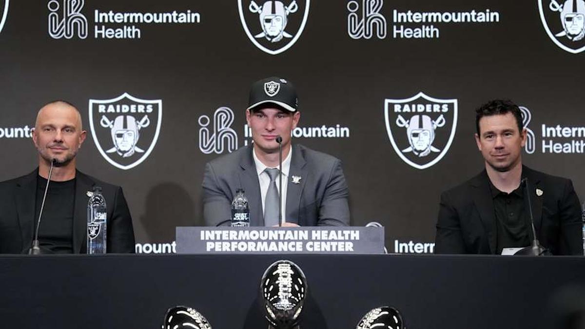  Apr 24, 2026; Henderson, NV, USA; Las Vegas Raiders quarterback Fernando Mendoza (center) speaks at introductory press conference at Intermountain Health Performance Center flanked by general manager John Spytek (left) and head coach Klint Kubiak after being selected as the No. 1 pick in the 2026 NFL Draft. Mandatory Credit: Kirby Lee-Imagn Images | Kirby Lee-Imagn Images 