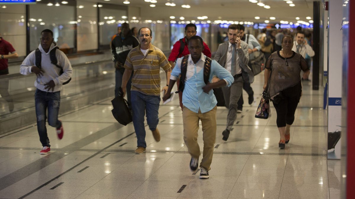 Travelers at the Ataturk Airport flee after two explosions followed by gunfire hit Turkey's biggest airport, killing dozens and injuring many on June 28, 2016, in Istanbul. File Photo by Laurance Cameron/UPI