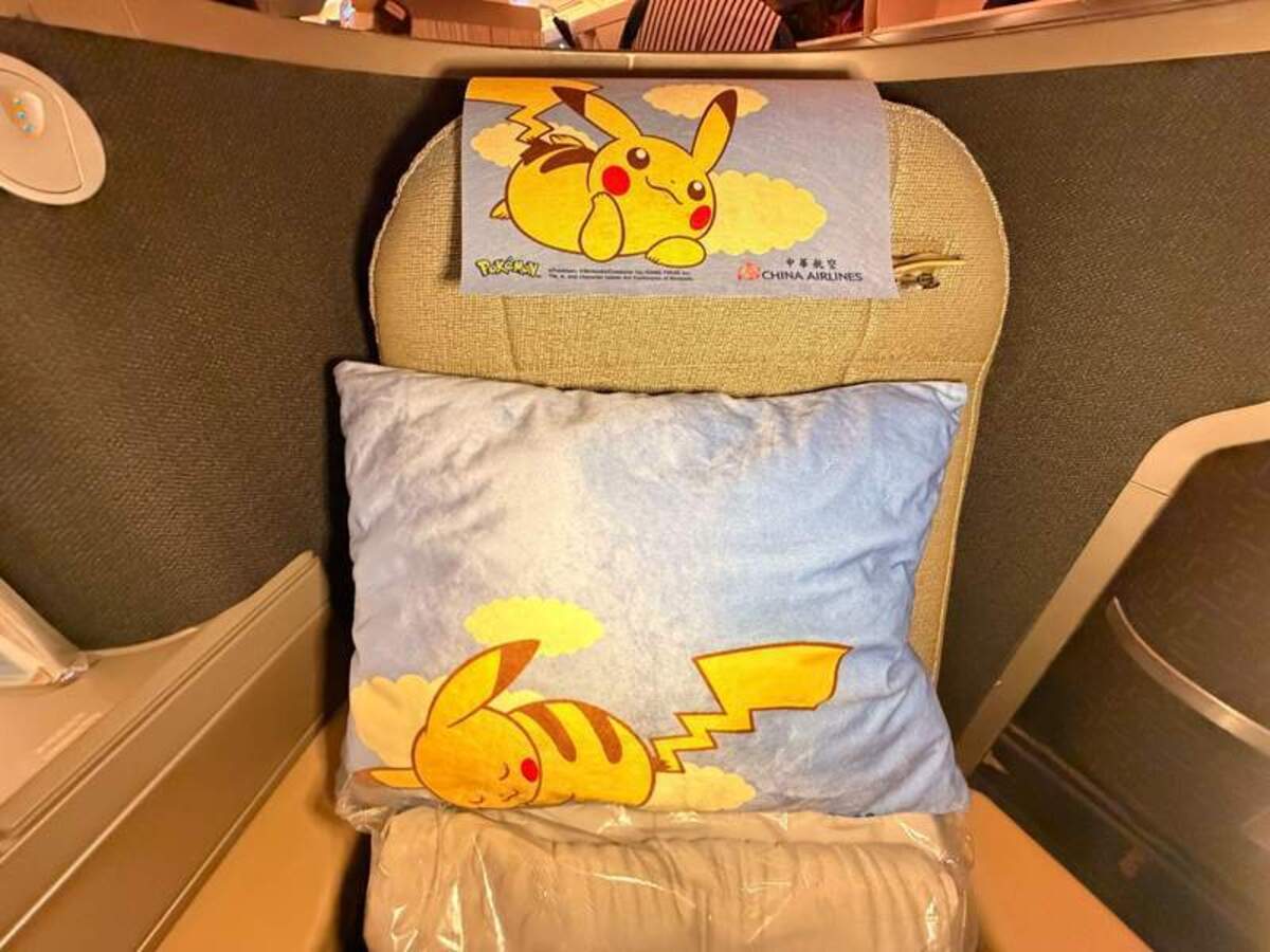 Business class seat with Pikachu pillow and headrest. Photo credit: Peggy Cleveland 