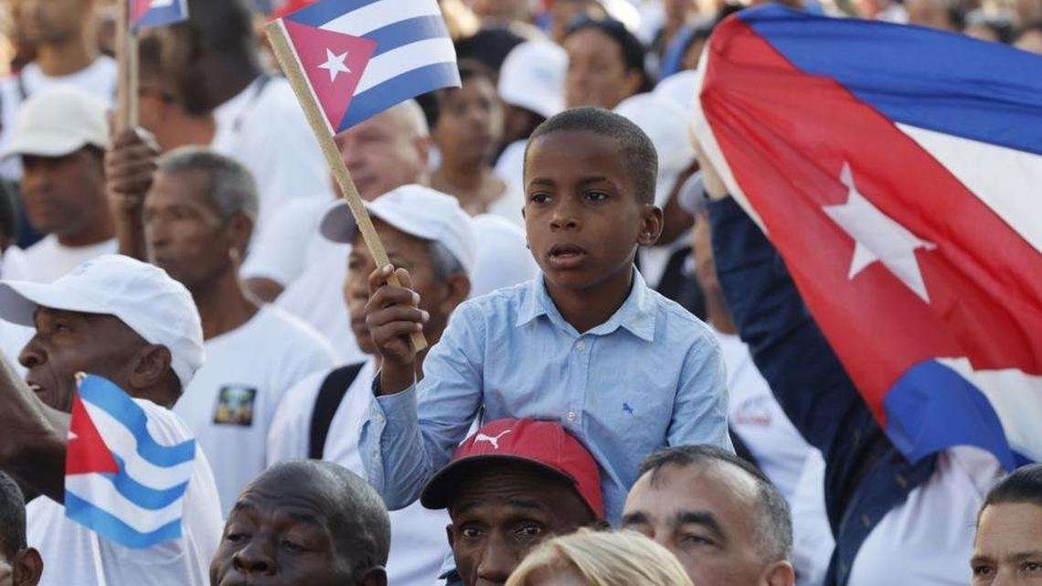 Despite energy and food shortages, residents participate in the commemoration of the 65th anniversary of the proclamation of the socialist character of the Cuban Revolution, in Havana on Thursday. Photo by Ernesto Mastrascusa/EPA