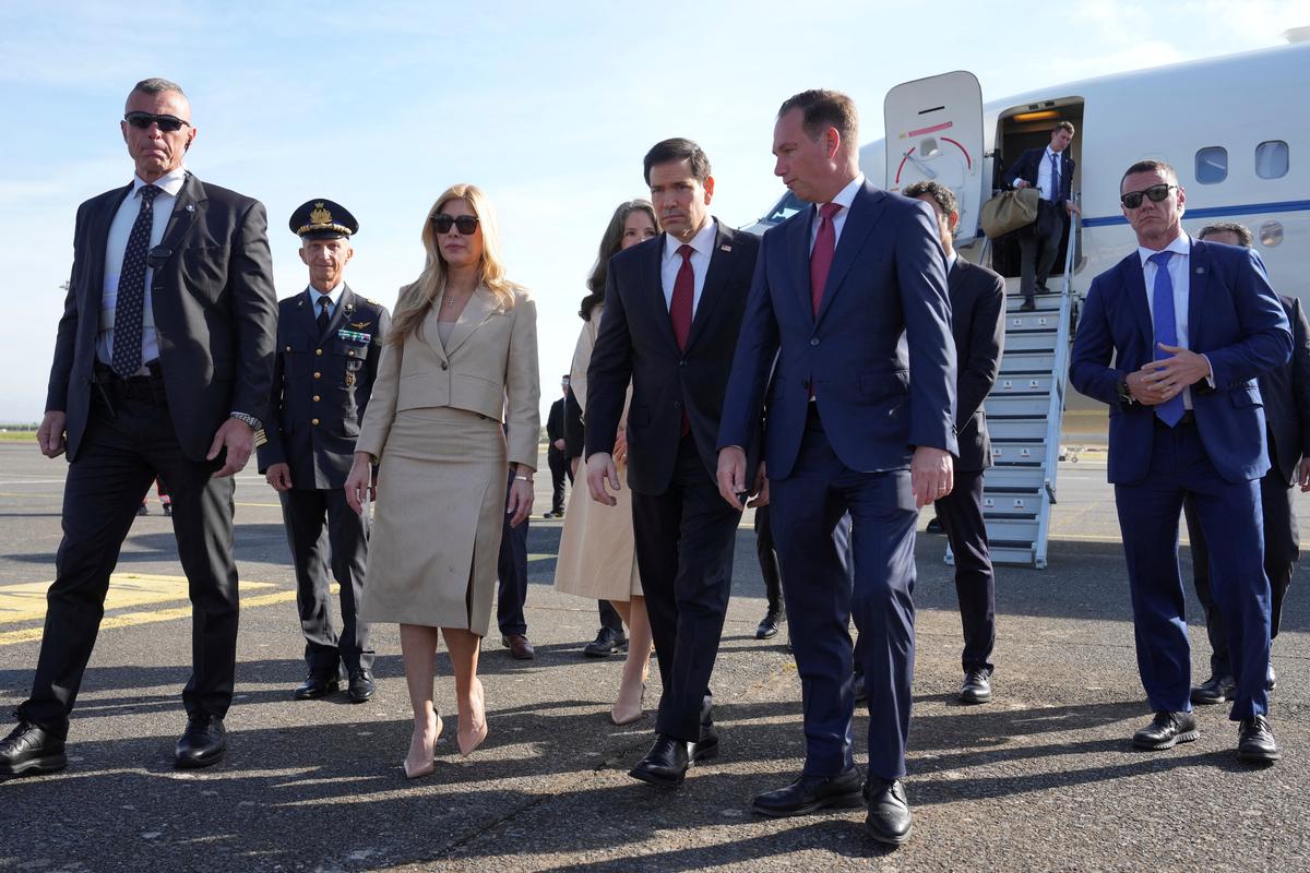 U.S. Secretary of State Marco Rubio meets U.S. Ambassador to the Holy See Brian Burch upon his arrival for a two-day visit to Italy and the Vatican, at Ciampino airport, in Rome, Italy, May 7, 2026. Andrew Medichini/Pool via REUTERS
