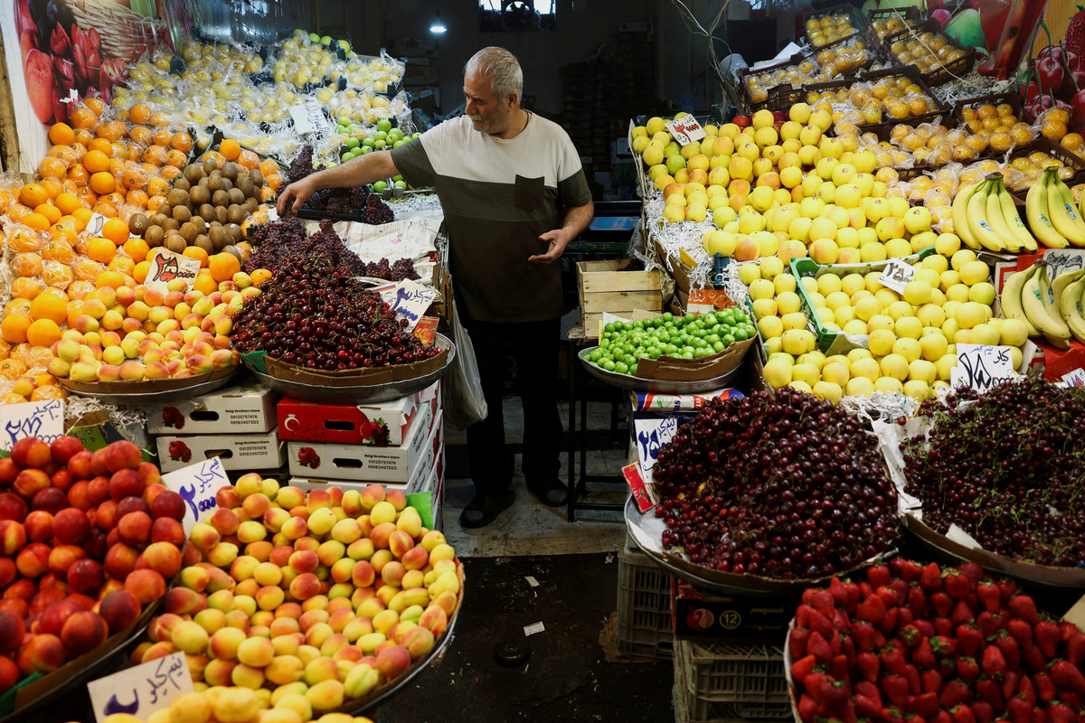 FILE PHOTO: A man works at his store in a local market in Tehran, Iran, June 11, 2026. Majid Asgaripour/WANA (West Asia News Agency) via REUTERS/File Photo
