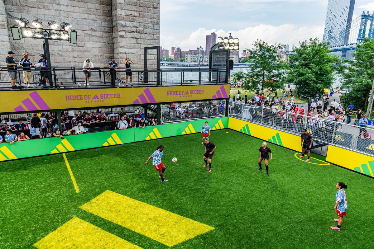 Players compete during an Adidas Home of Soccer event in Brooklyn Bridge Park in New York on June 26, 2026. As World Cup matches take place across the United States, Nike and Adidas, the two largest sportswear companies in the world, are spending millions of dollars in a duel over the future of soccer in America. (Emma Rose Milligan/The New York Times)