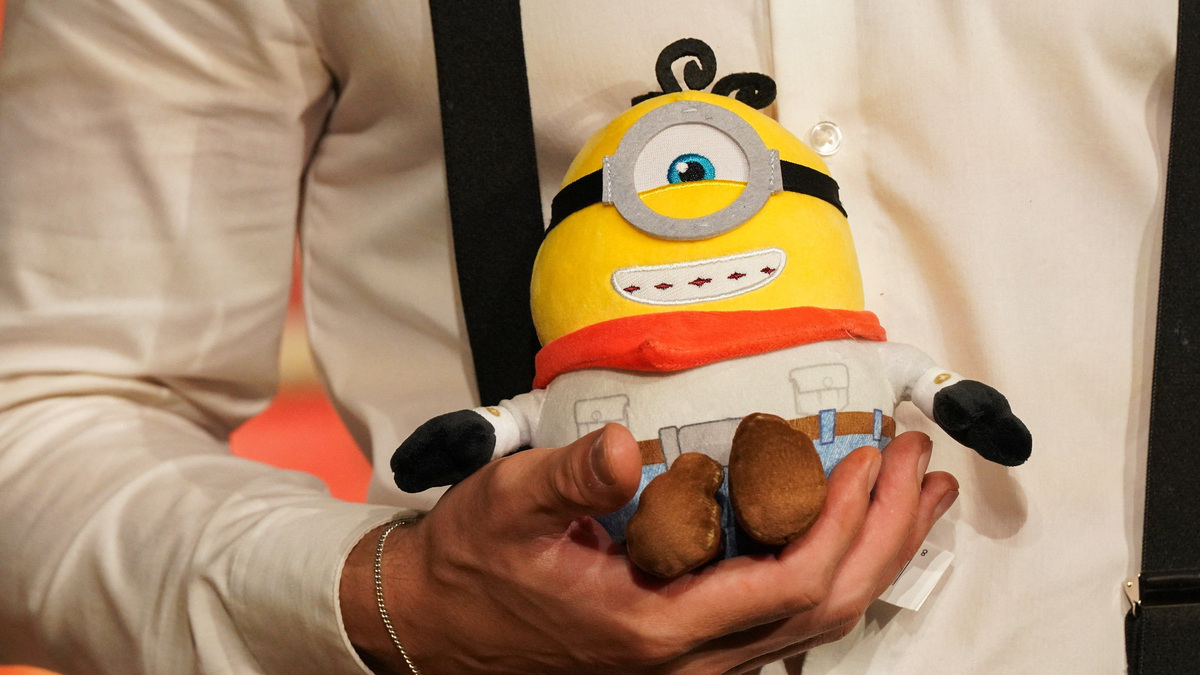 An attendee holds a stuffed Minions toy at the "Minions & Monsters" premiere in Los Angeles, California, U.S., June 28, 2026. REUTERS/Lauren Justice